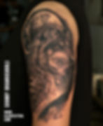 lion and wolf dualism tattoo
