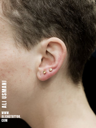 lobe piercing At Aliens Tattoo Studio