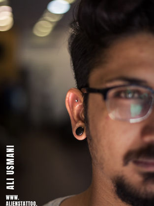 earlobe piercing At Aliens Tattoo Studio