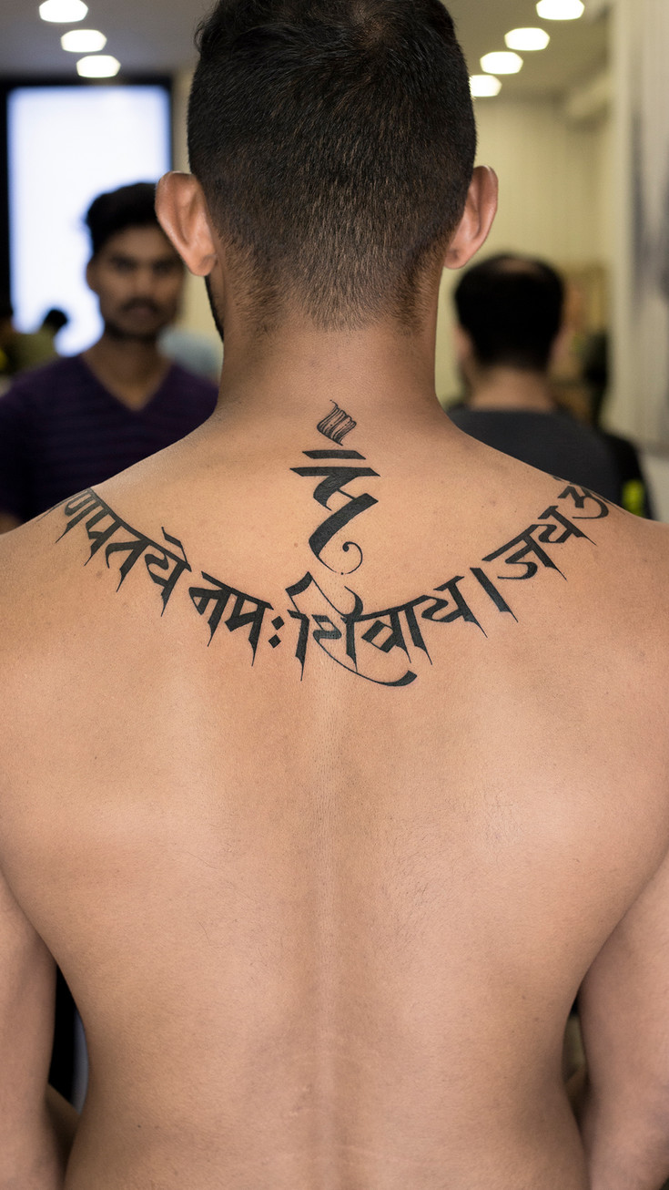 neck script tattoo