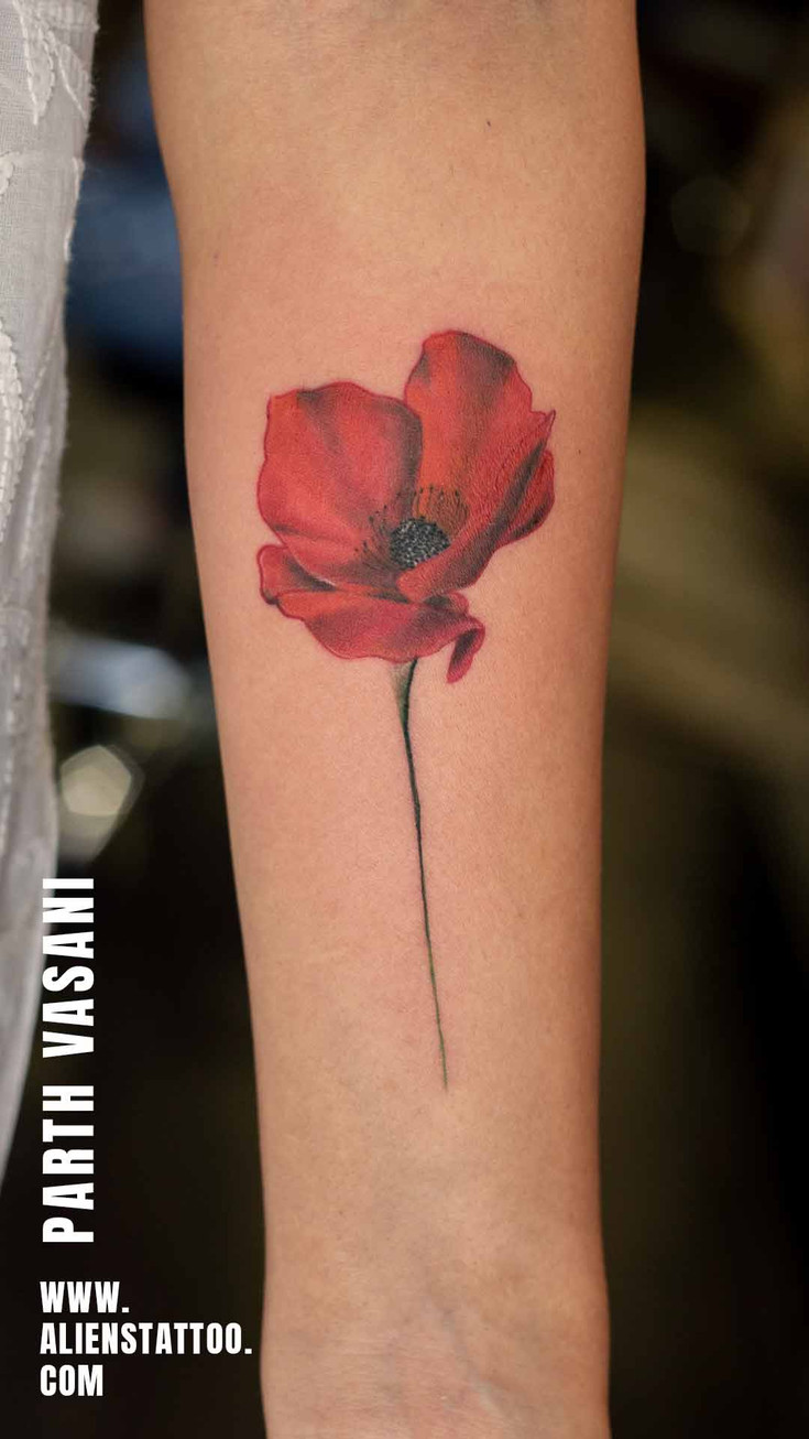 small red flower tattoo